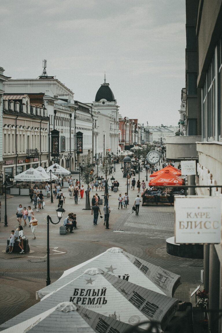Vibrant downtown street scene with historic architecture, people walking, and cafes in sight on Bauman Street, Kazan.