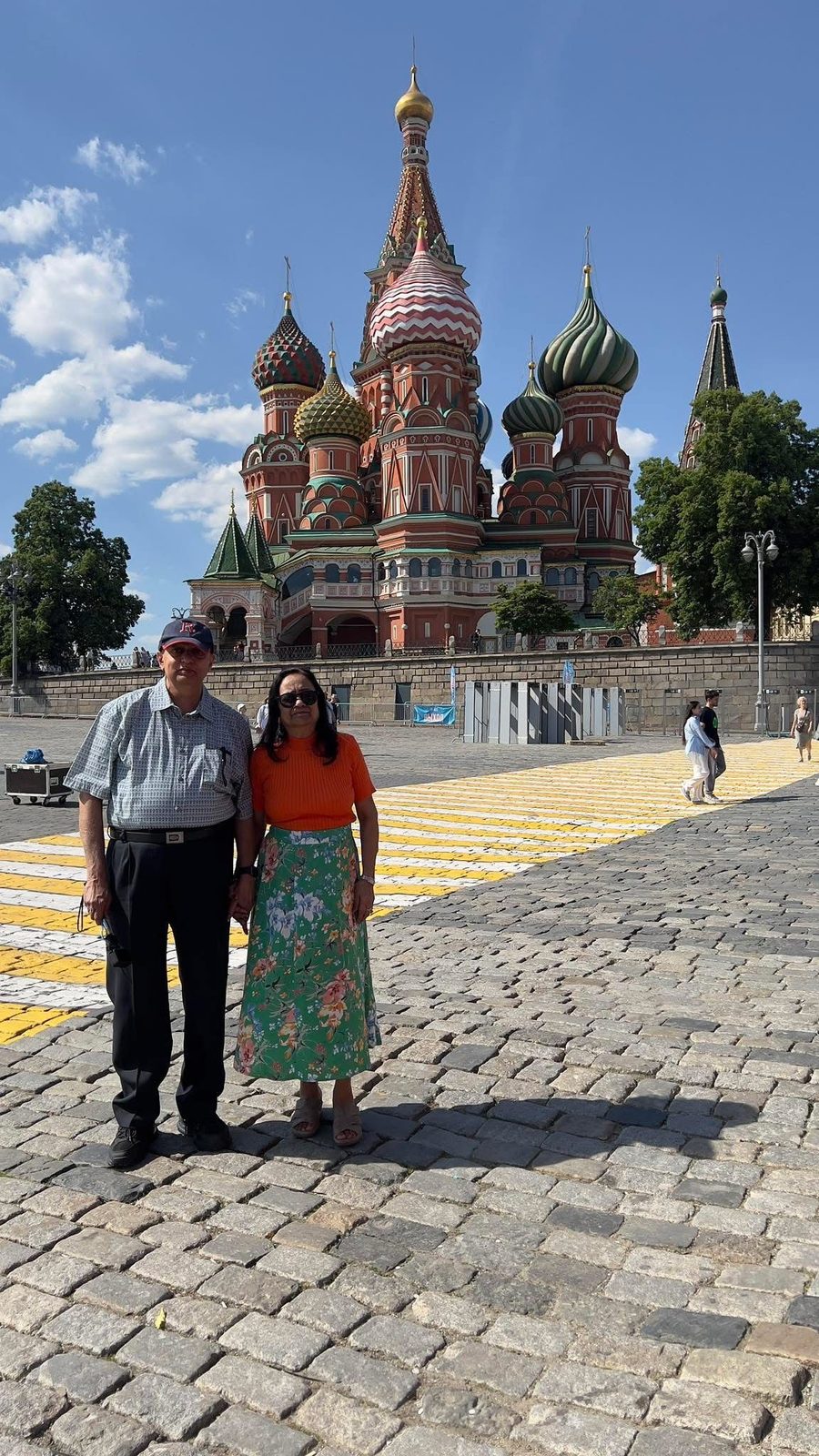 Rajendra and Jayshree standing on Red Square with St Basil's Cathedral behind them