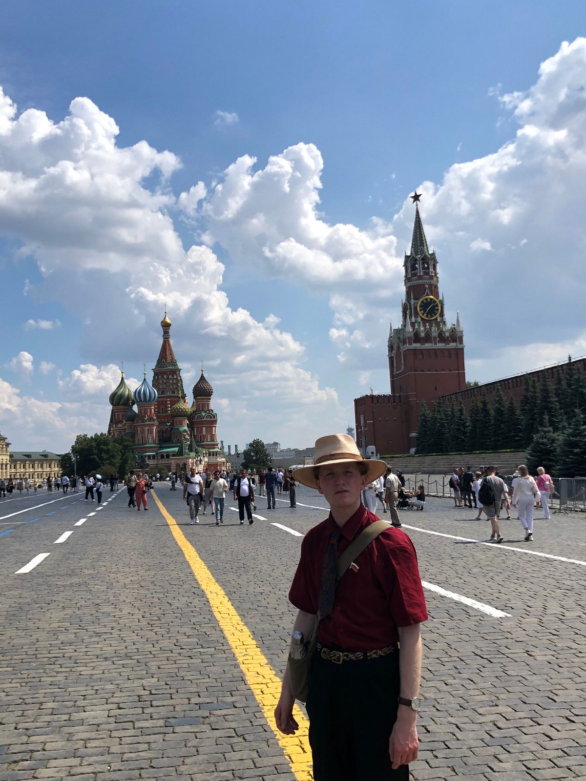 Ernst standing on Red Square in Moscow with St Basil's Cathedral and the Spasskaya Tower behind him