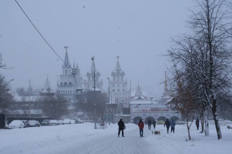 The colourful towers of the Izmailovo Kremlin seen through falling snow