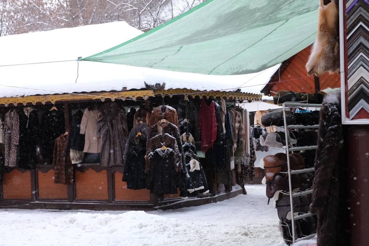 Souvenir stalls with coats and fur at the Izmailovo Vernissage market in Moscow