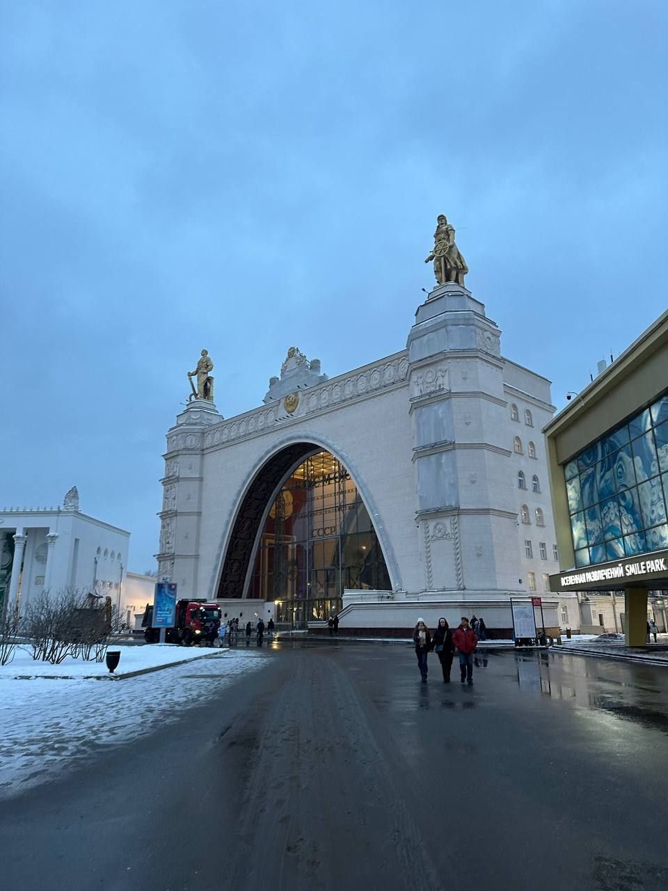 The main entrance arch of VDNH in Moscow with its sculpture on top