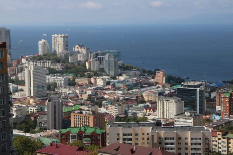 View over the rooftops and tower blocks of Vladivostok down to the sea